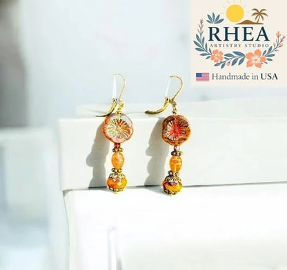 Handcrafted Mustard Hibiscus Drop earrings featuring Czech beads, artisan-made with a warm floral-inspired design.