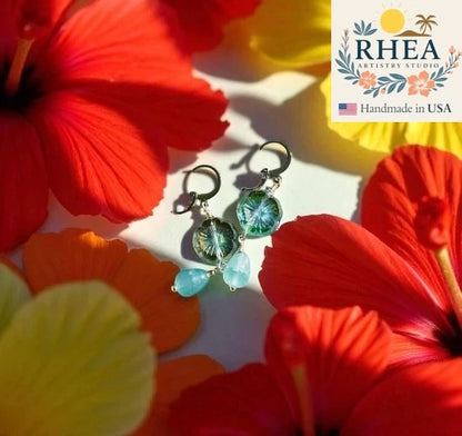 Handcrafted Hibiscus Light Blue Silver Drop earrings featuring Czech beads, artisan-made with a delicate floral design.
