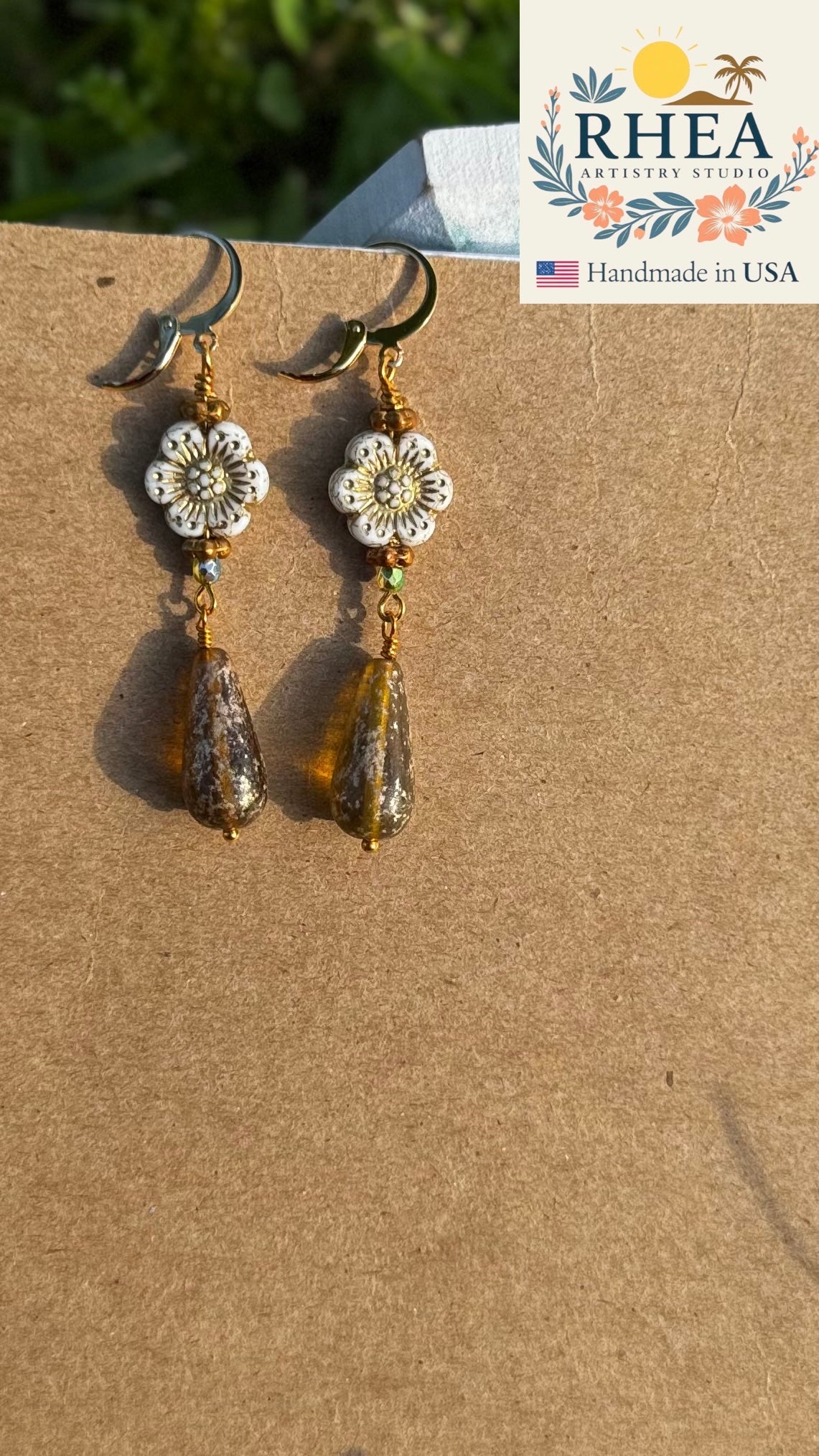 Stylish White Hibiscus Gold Drop earrings, handmade with Czech beads for a timeless artisan accessory.