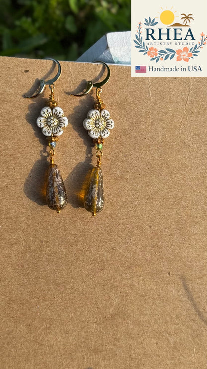 Stylish White Hibiscus Gold Drop earrings, handmade with Czech beads for a timeless artisan accessory.