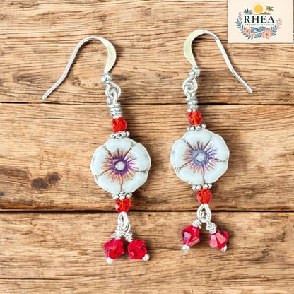 Handmade earrings with Czech hibiscus beads, vintage Austrian crystals, and silver-plated hooks. Tropical, vibrant, and full of handcrafted charm.