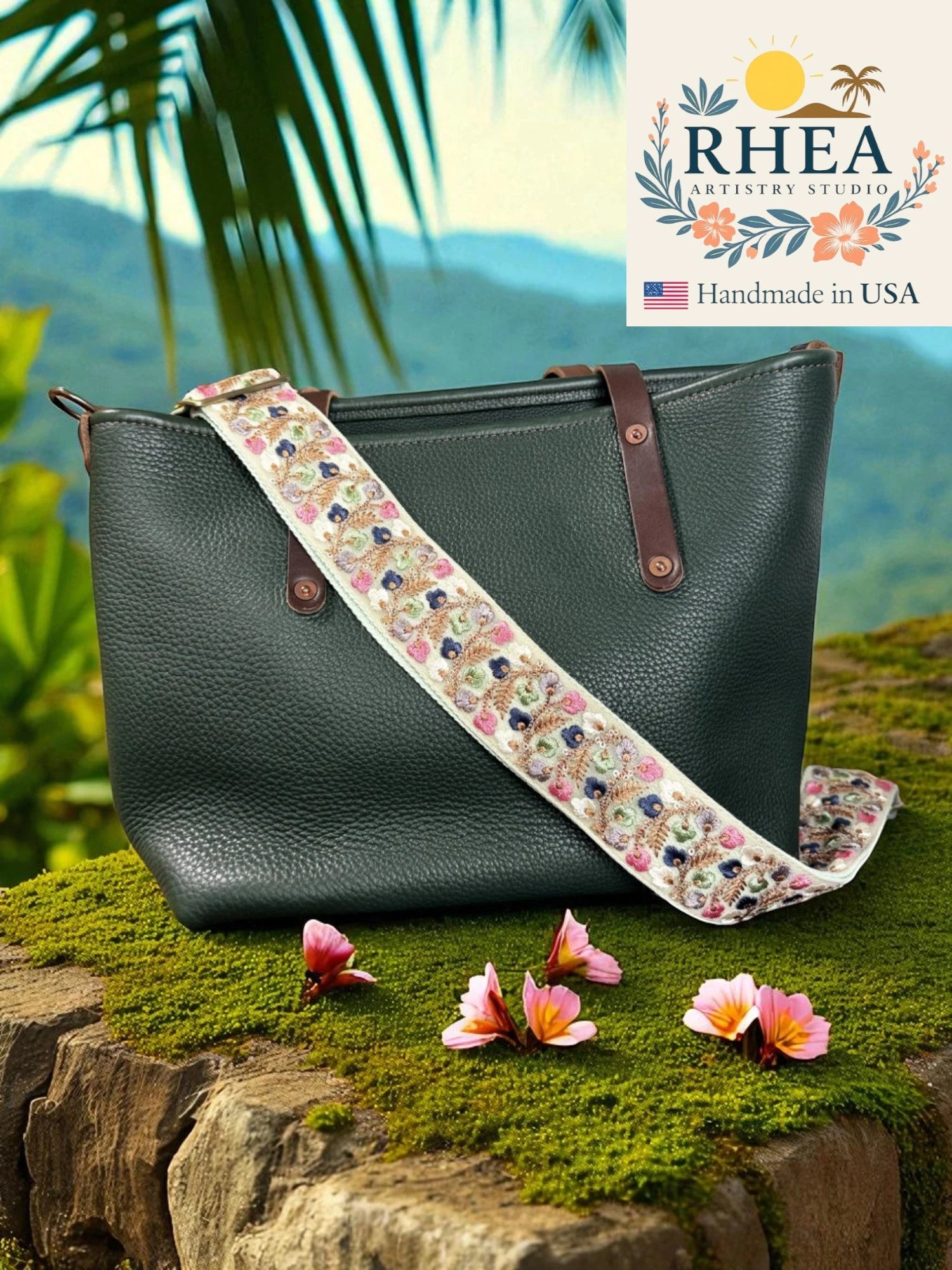 Green handbag with a floral purse strap on a natural background, featuring the Rhea Artistry Studio logo.