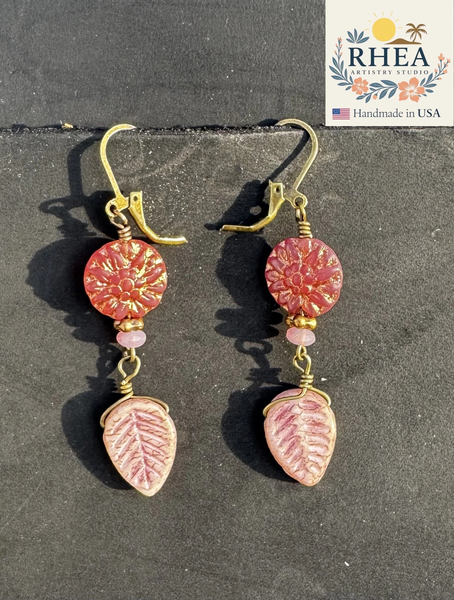 Stylish Pink Dahlia Leafy Drop earrings, handmade with Czech beads for a graceful artisan accessory.