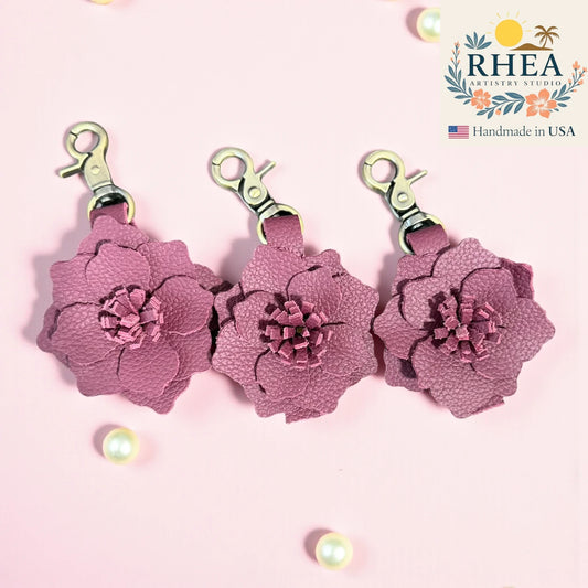 Artisan Plum Radiance small leather flower charm, 2.5-inch design crafted as a purse charm, bag charm, keychain, or zipper pull.