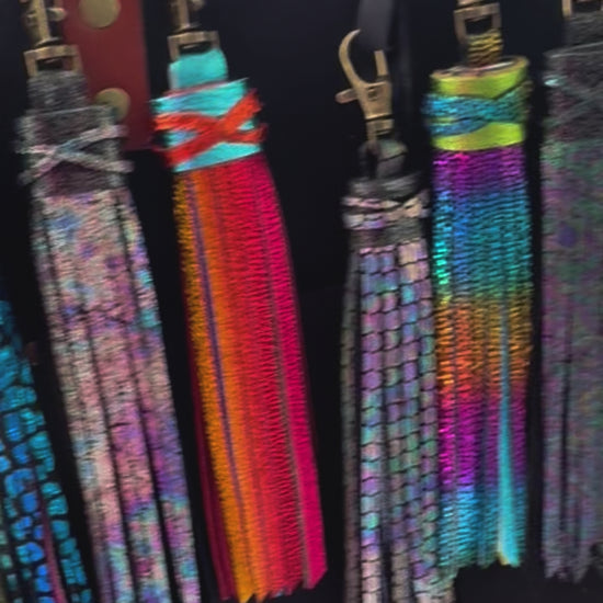 video of a purse with multi colored tassel