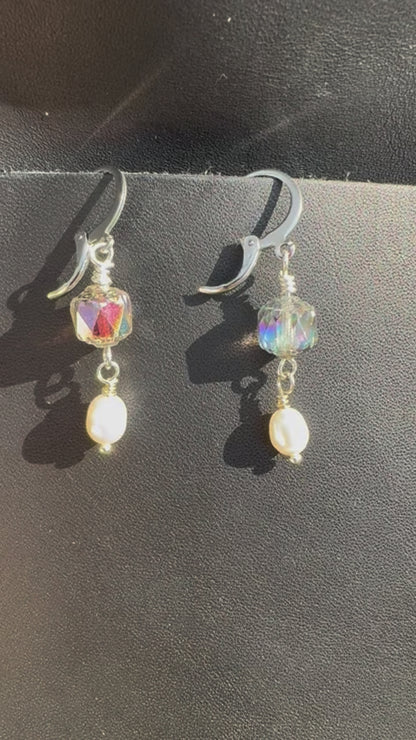 Pair of earrings on a black bag