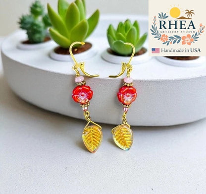 Elegant handmade Red Hibiscus and Pink Bead Drop earrings with Czech beads, designed as unique artisan pink and gold floral jewelry.
