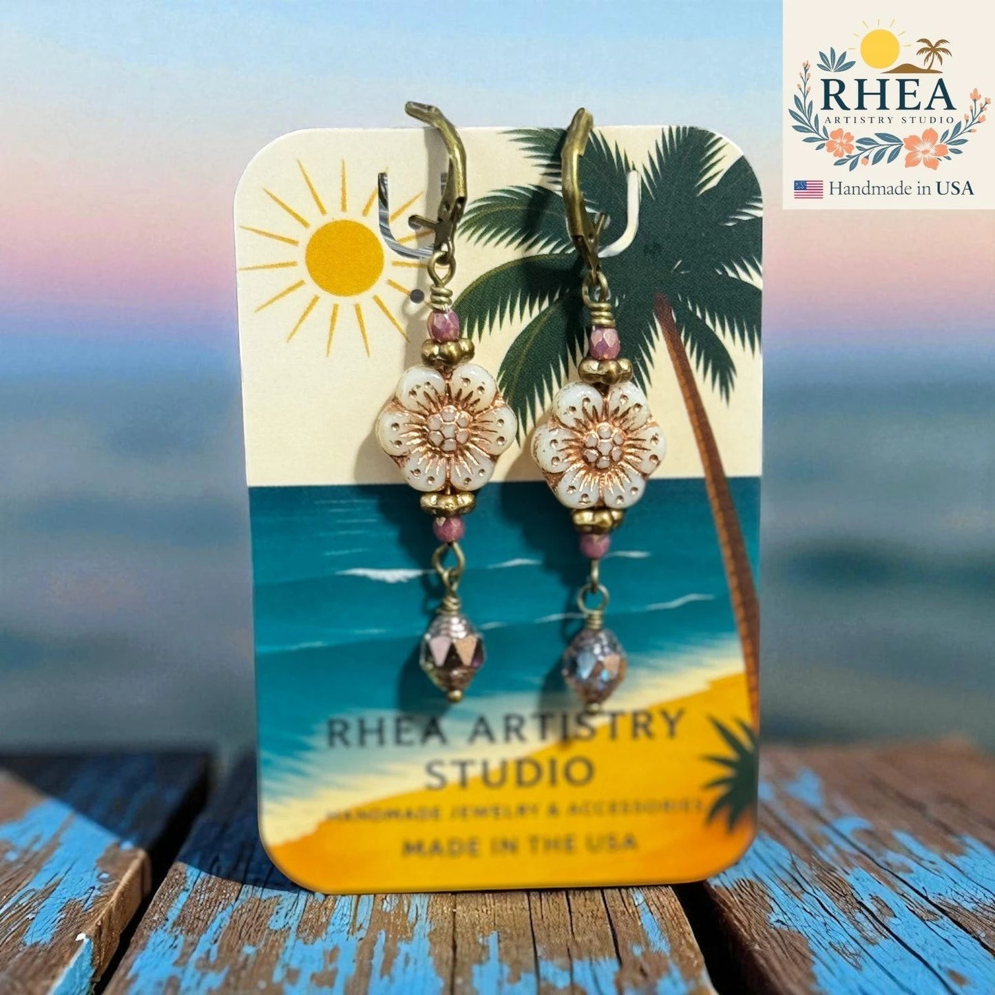 Rhea Artistry Studio floral dangle earrings with Czech glass beads, rose gold accents, and antique brass French hooks. Approx. 1.5 inches.