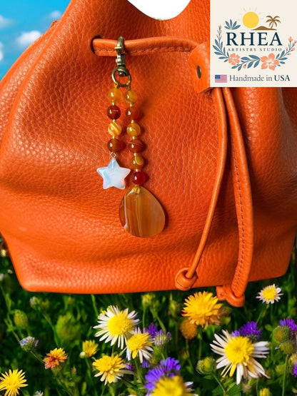 Rhea Artistry Studio handmade agate and moonstone star bag charm with teardrop pendant, 5 inches long.