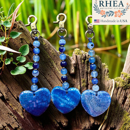 Rhea Artistry Studio blue agate heart bag charm with beaded strand and brass clasp, handmade in USA.