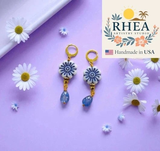 Rhea Artistry Studio blue and white floral Czech glass bead drop earrings with blue gemstone accents and gold plated brass findings.