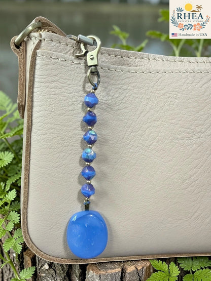 Rhea Artistry Studio blue fused glass pendant bag charm with Czech glass beads and brass accents.