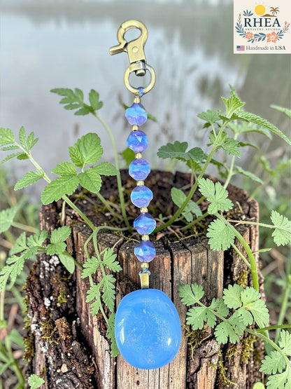 Rhea Artistry Studio blue fused glass pendant bag charm with Czech glass beads and brass accents.