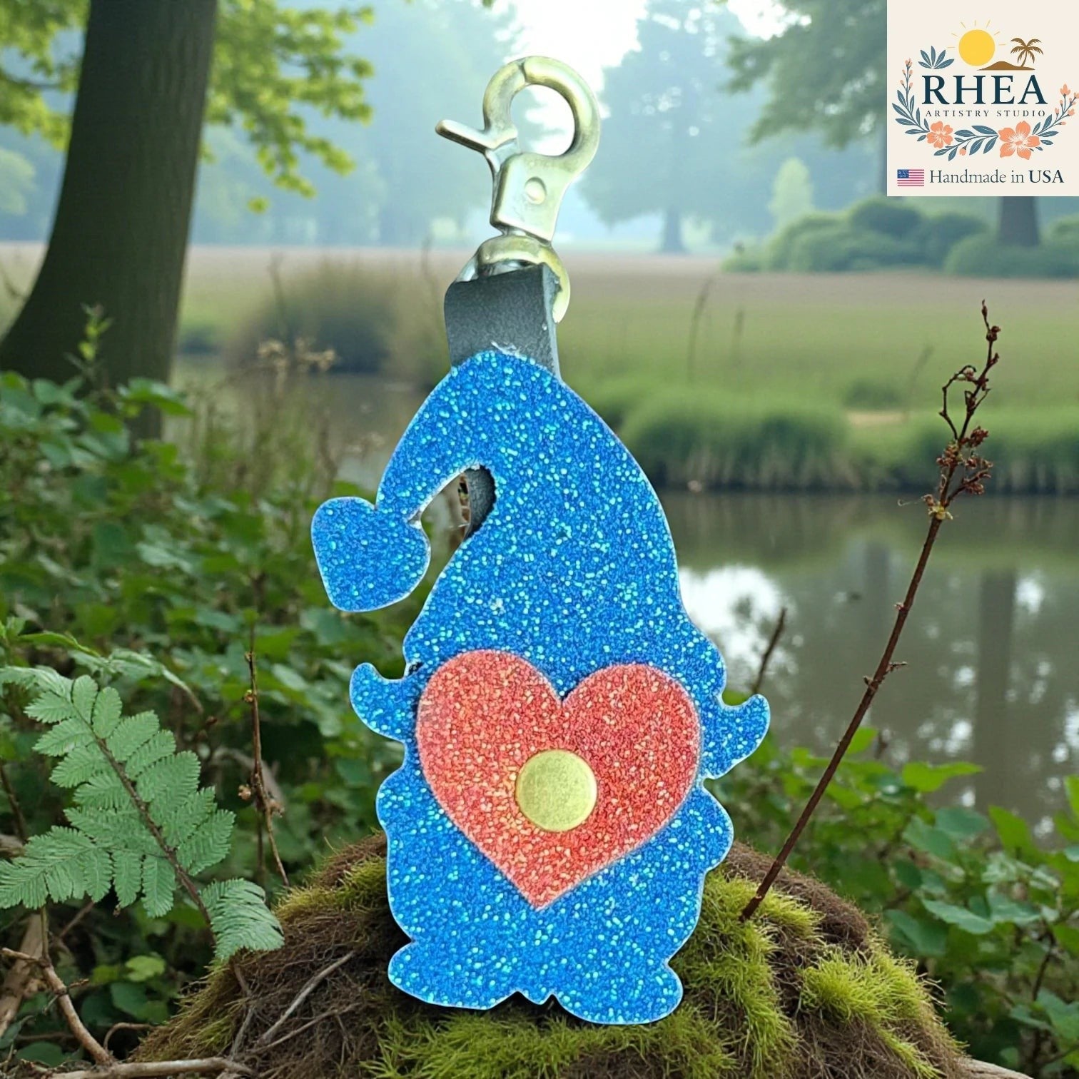 Rhea Artistry Studio blue glitter leather gnome charm with red heart detail and brass hardware, handmade in USA.