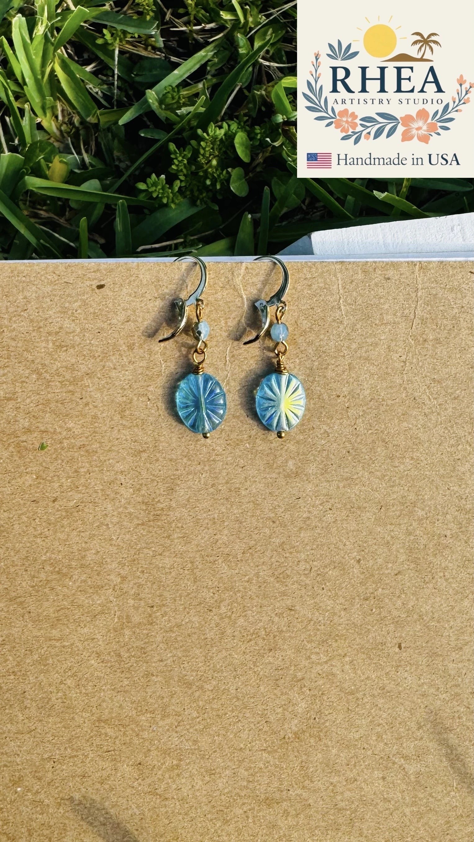 Rhea Artistry Studio blue starburst oval Czech glass earrings with 24k gold plated brass findings and French lever backs.