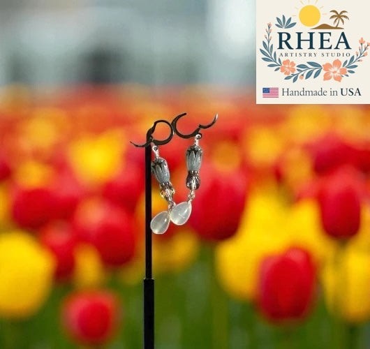 Rhea Artistry Studio blue tulip Czech glass earrings with silver accents and French lever backs.