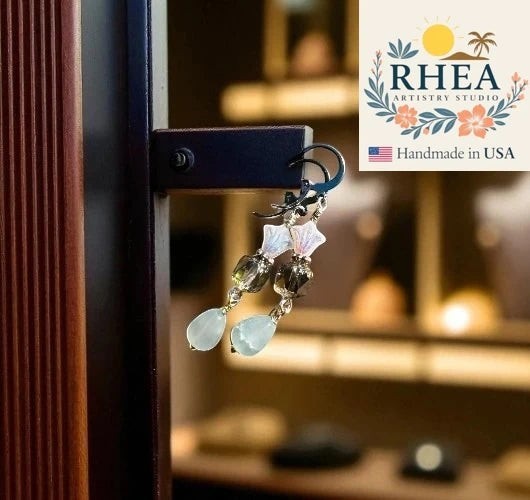 Rhea Artistry Studio white and silver three petal cathedral drop earrings with gemstone teardrop.