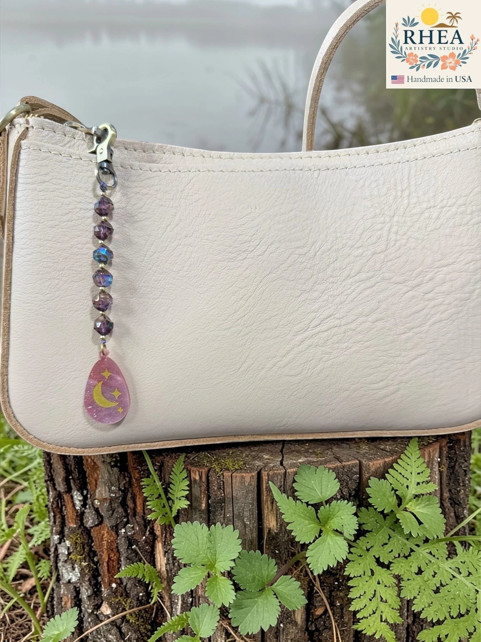 Rhea Artistry Studio moon and stars pendant bag charm with Czech glass beads and brass accents.