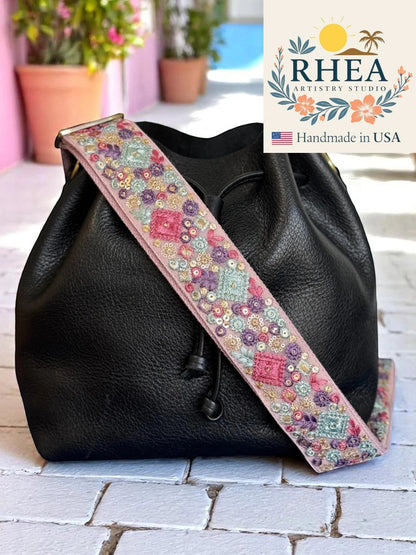 Rhea Artistry Studio pink embroidered crossbody strap with gem mosaic pattern, 2 inches wide, adjustable length, and brass hardware.