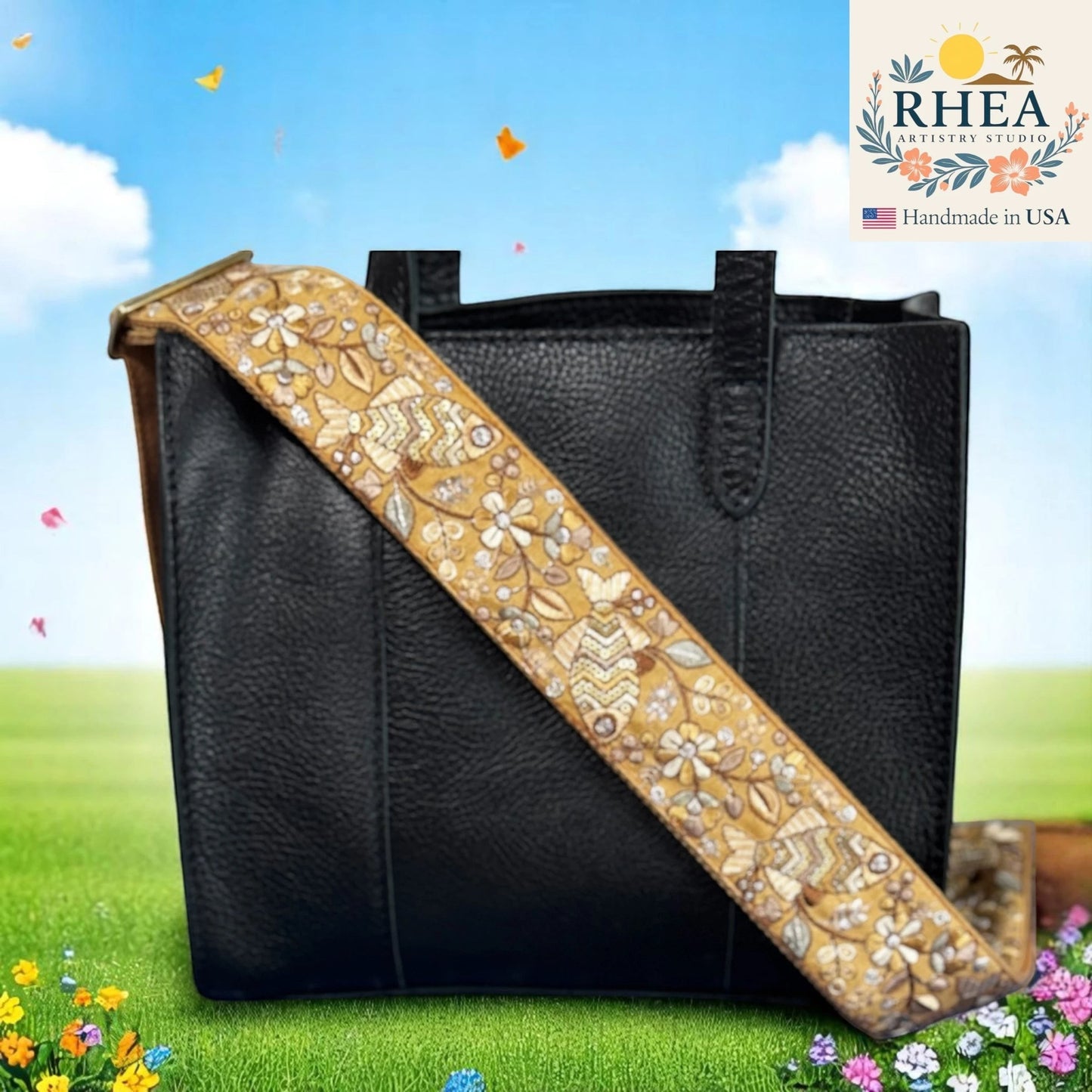 Rhea Artistry Studio 2-inch wide crossbody strap with embroidered fish and floral lace on tan background, adjustable with brass hardware.