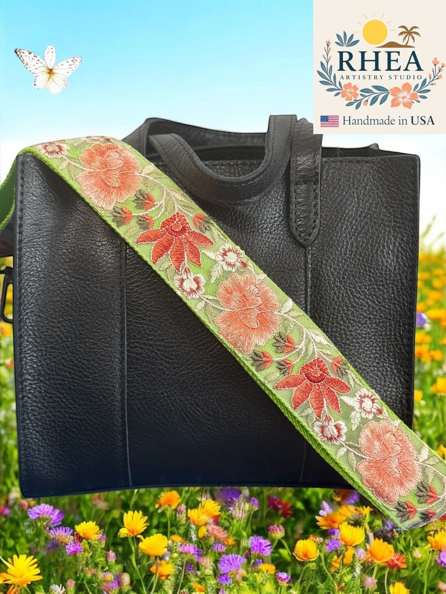 Rhea Artistry Studio green crossbody strap with coral floral embroidery, 2-inch wide, adjustable, with brushed brass hardware.