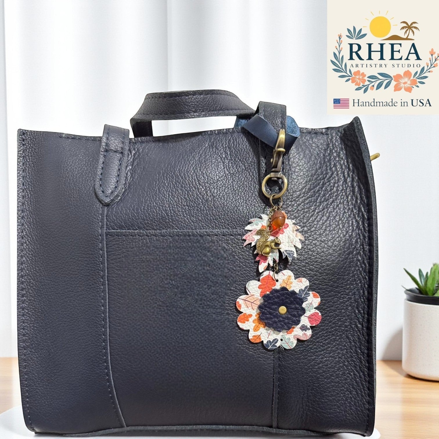 Rhea Artistry Studio fall leather charms featuring acorn and floral designs, perfect as bag accessories or keychains.