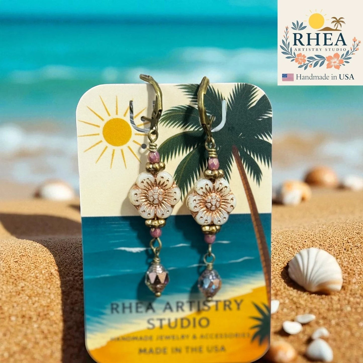 Rhea Artistry Studio floral dangle earrings with Czech glass beads, rose gold accents, and antique brass French hooks. Approx. 1.5 inches.