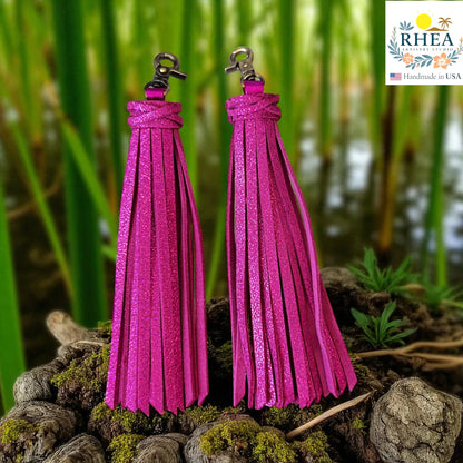 Rhea Artistry Studio handmade fuchsia glitter leather tassel keychain with lobster clasp, 7.25" long.