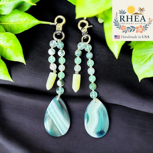 Rhea Artistry Studio Atlantic Haze double-strand gemstone charm with agate, quartz, and jade beads and antique brass clasp.