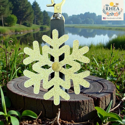 Rhea Artistry Studio glitter snowflake mini charm, handmade from glitter leather with a brass accent, perfect for bags and keychains.