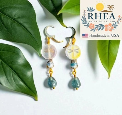 Rhea Artistry Studio gold laser etched dragonfly earrings with Czech glass beads and blue gemstone drops.