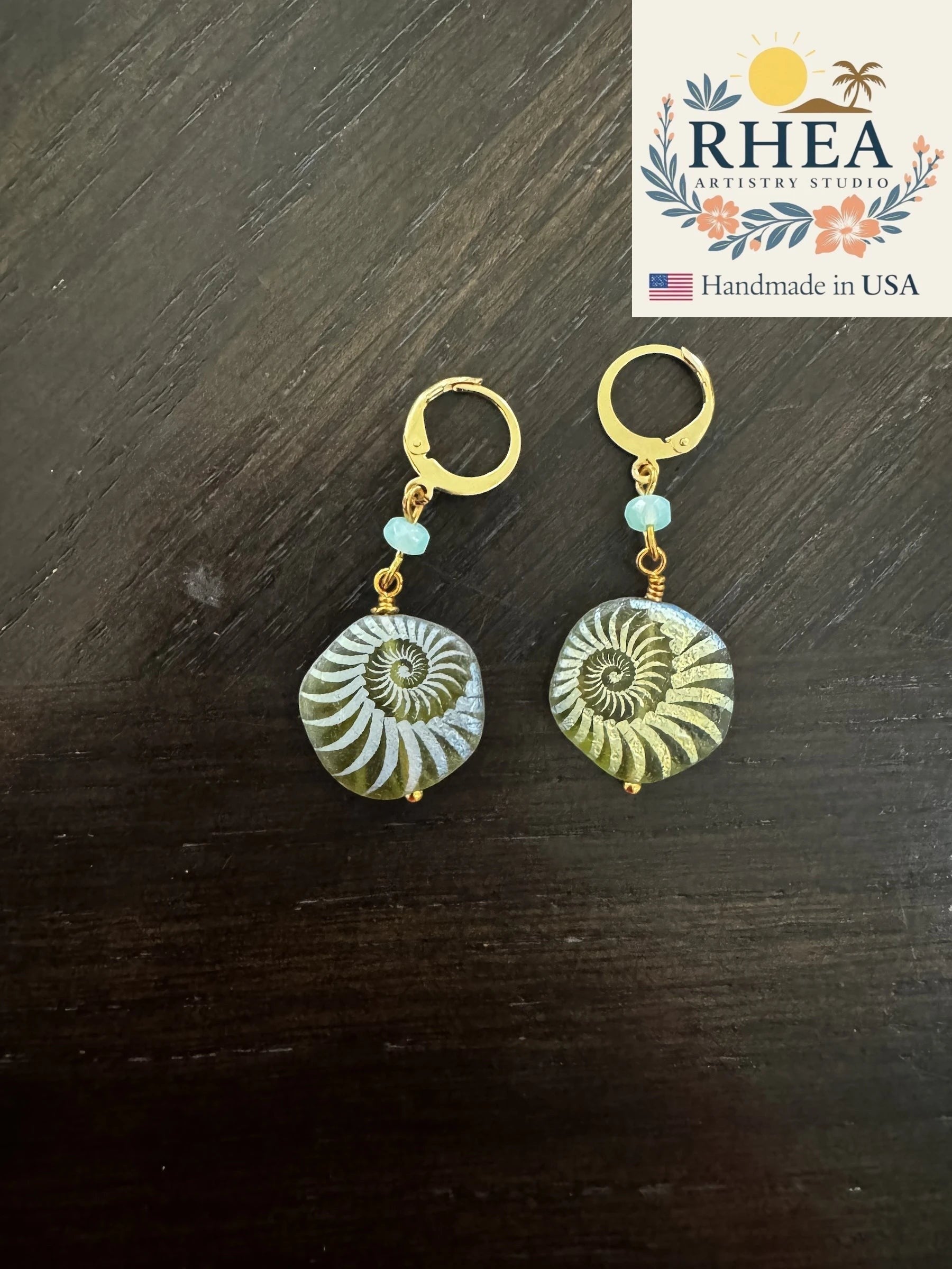 Rhea Artistry Studio handmade earrings with 24k gold plated brass leverbacks and laser-etched sea foam green Czech glass beads.