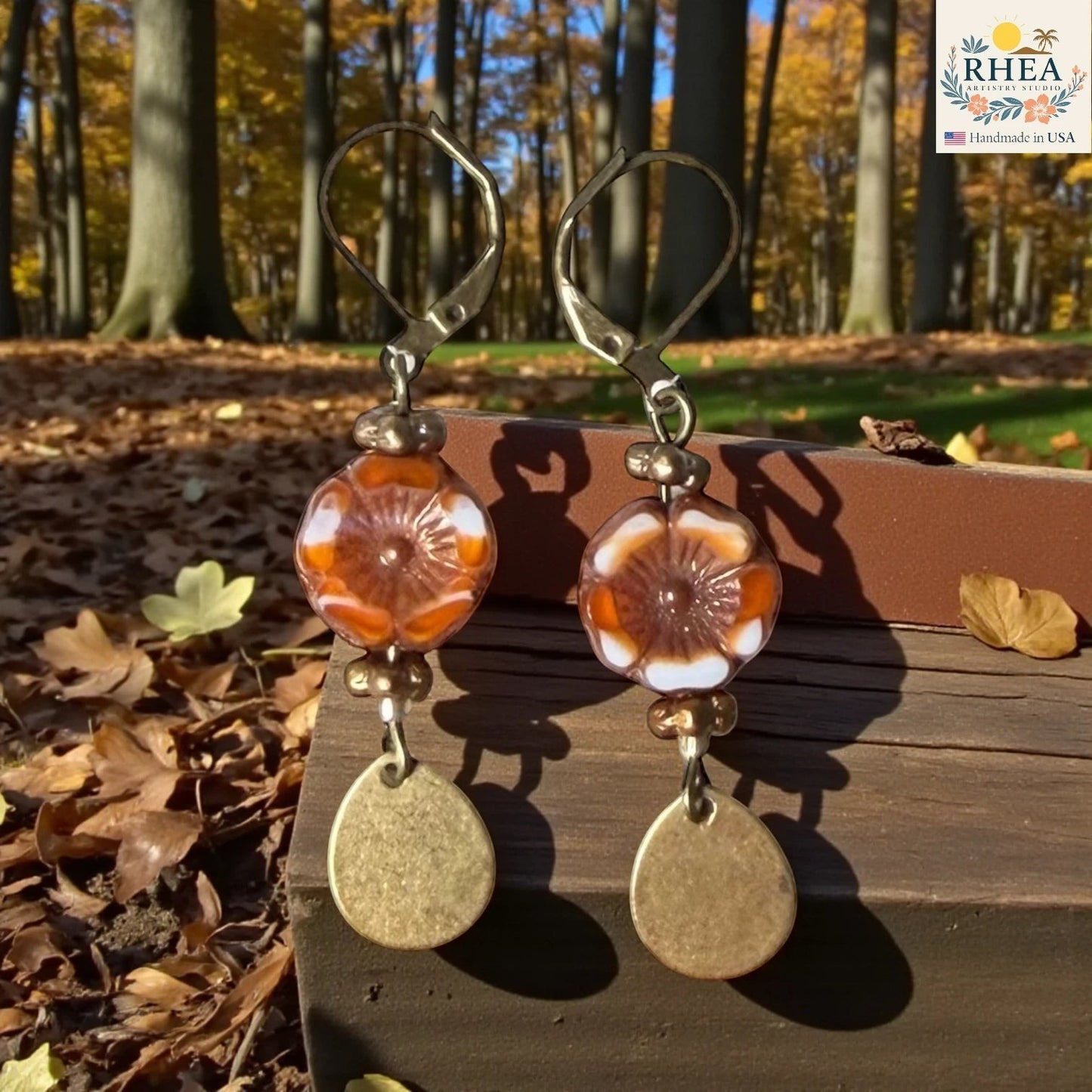 Rhea Artistry Studio handmade hibiscus garden glass drop earrings with brass hardware and French leverback hooks, approx. 2 inches long.
