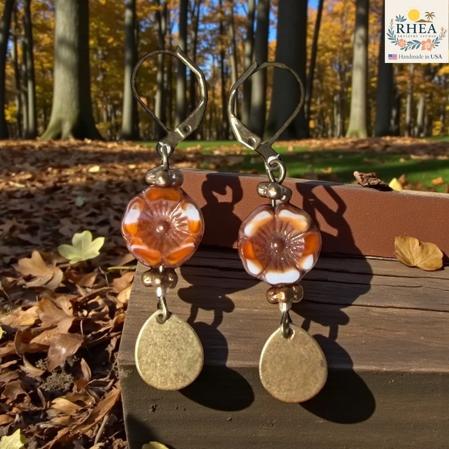 Rhea Artistry Studio handmade hibiscus garden glass drop earrings with brass hardware and French leverback hooks, approx. 2 inches long.