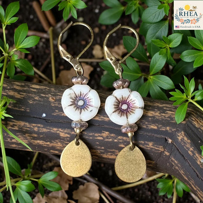 Rhea Artistry Studio white hibiscus glass bead drop earrings with brass teardrop charms and leverback hooks.