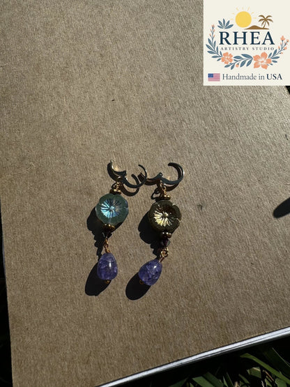 Rhea Artistry Studio hibiscus violet drop earrings with 24k gold plated brass, Czech glass, and amethyst gemstones.