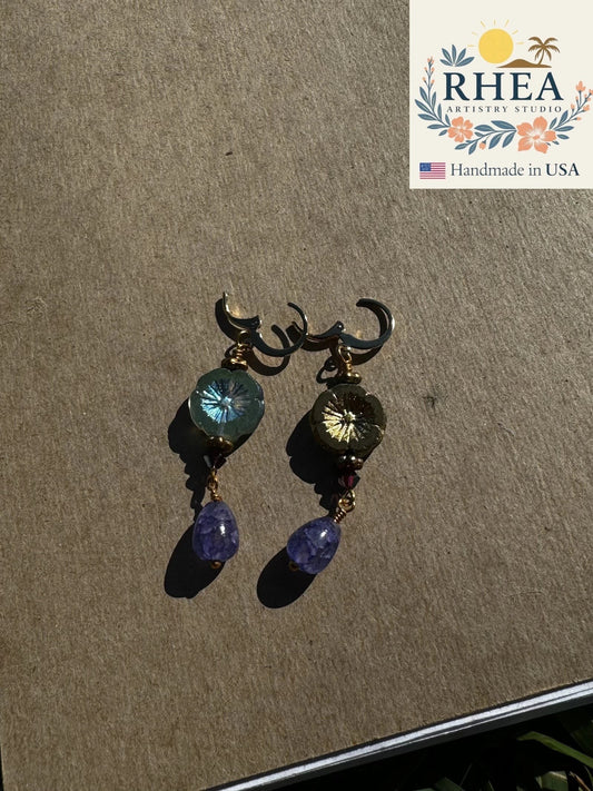 Rhea Artistry Studio 24k gold plated brass earrings with hibiscus-shaped Czech glass and purple gemstone drops.