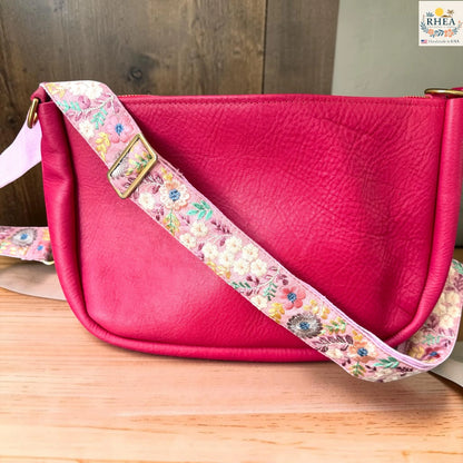 Rhea Artistry Studio ivory crossbody strap with pastel pink, yellow, and mint floral embroidery, 1.5-inch width, adjustable length.