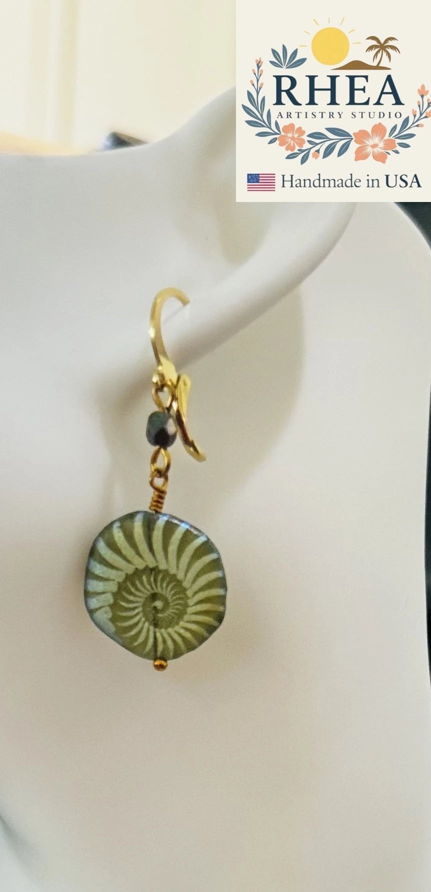 Rhea Artistry Studio handmade 1-inch earrings with 24k gold plated brass, featuring an avocado green Czech glass bead with laser etching.