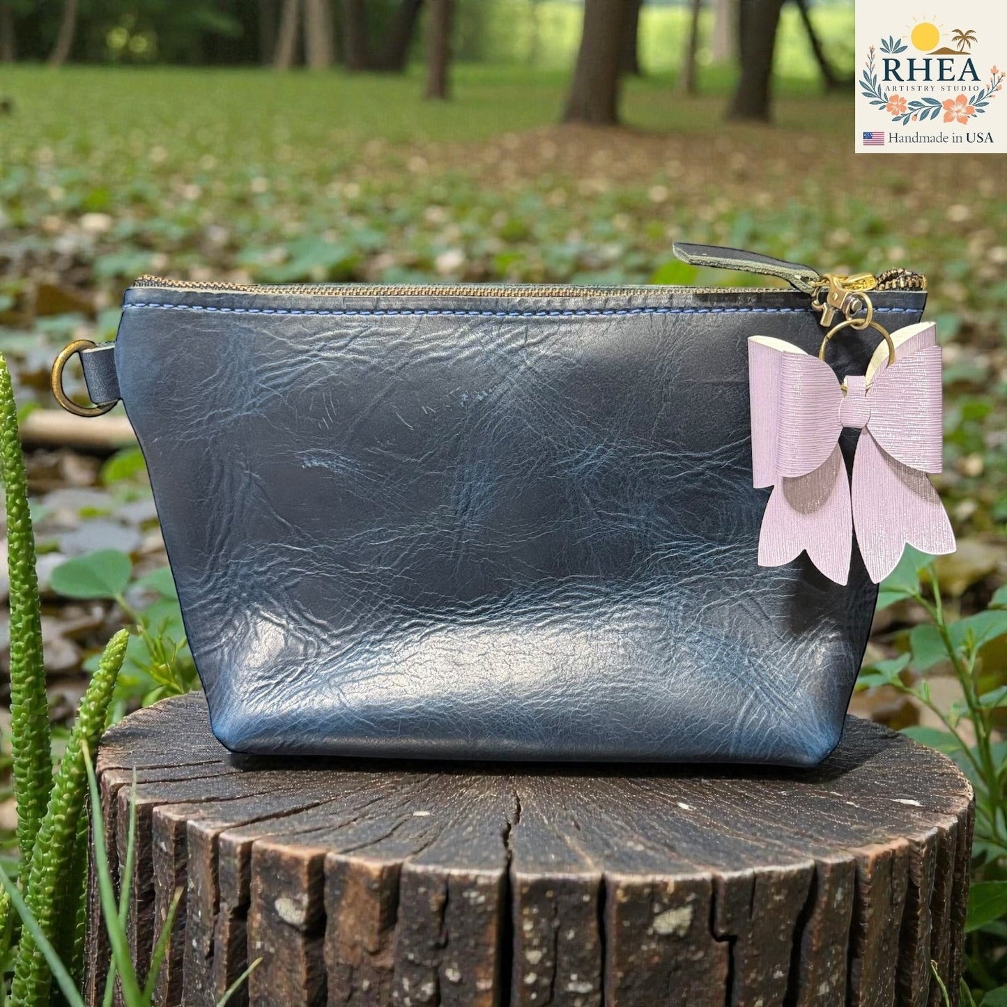 Rhea Artistry Studio lavender textured double-layer French bow bag charm with brass hardware.