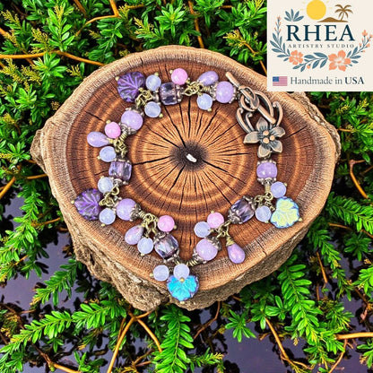 Rhea Artistry Studio handmade bracelet with lavender, lilac, and periwinkle glass beads and antique brass accents.