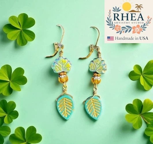 Rhea Artistry Studio handmade brass leaf earrings with blue and green glass accents, approx. 2 inches long.