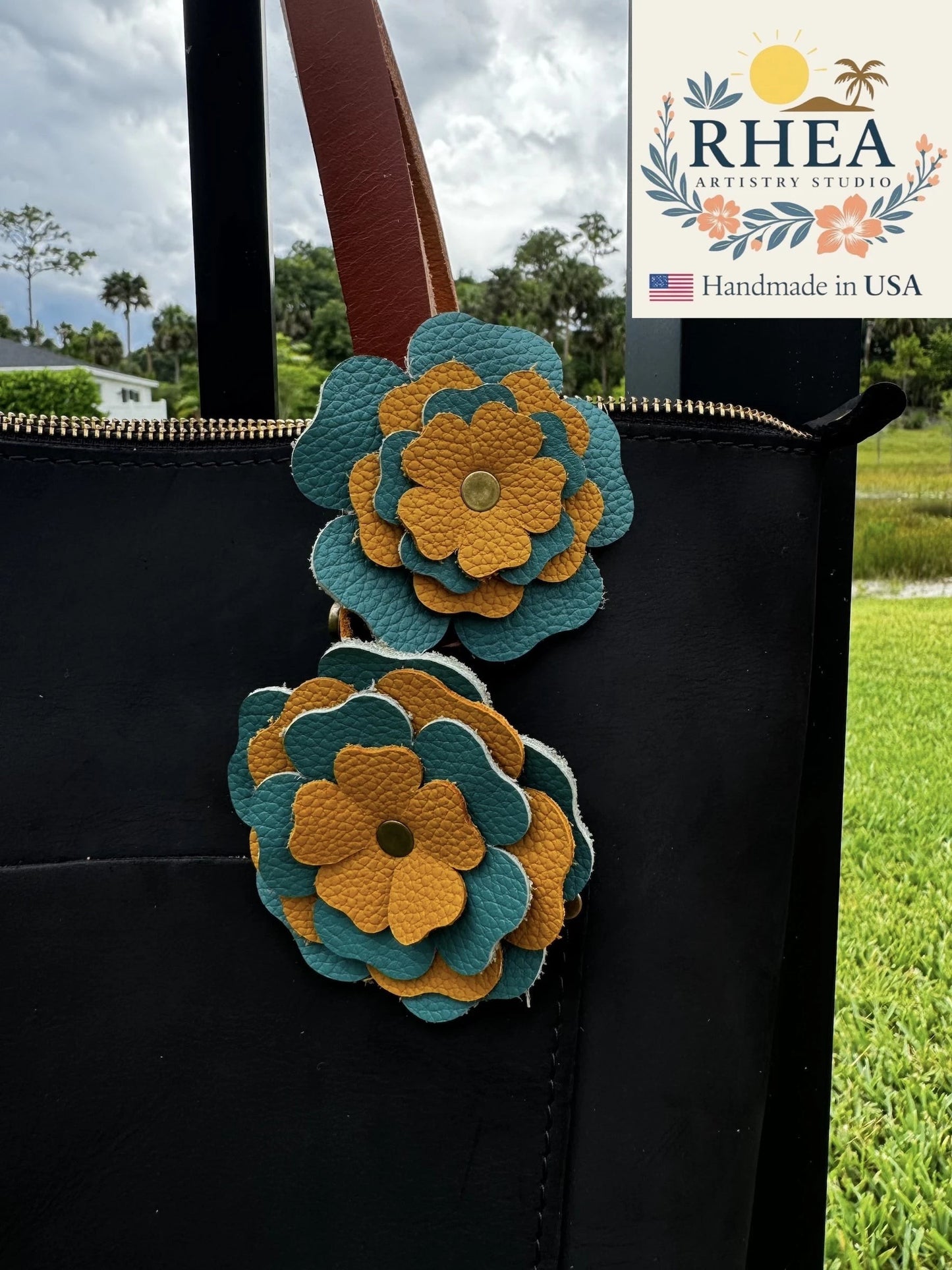 Rhea Artistry Studio handmade turquoise and yellow double leather flower bag charm with brass rivets.