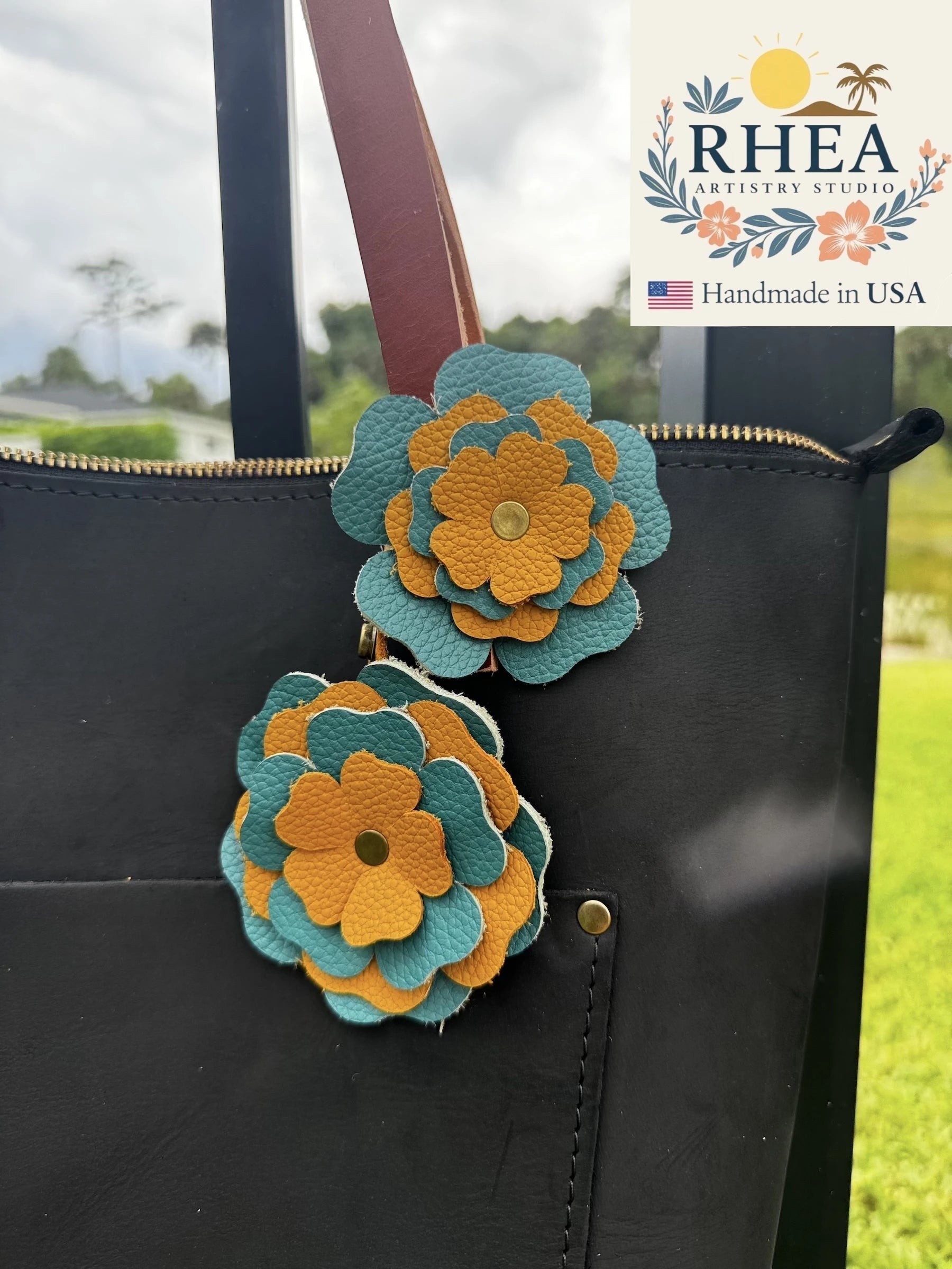 Rhea Artistry Studio handmade turquoise and yellow double leather flower bag charm with brass rivets.