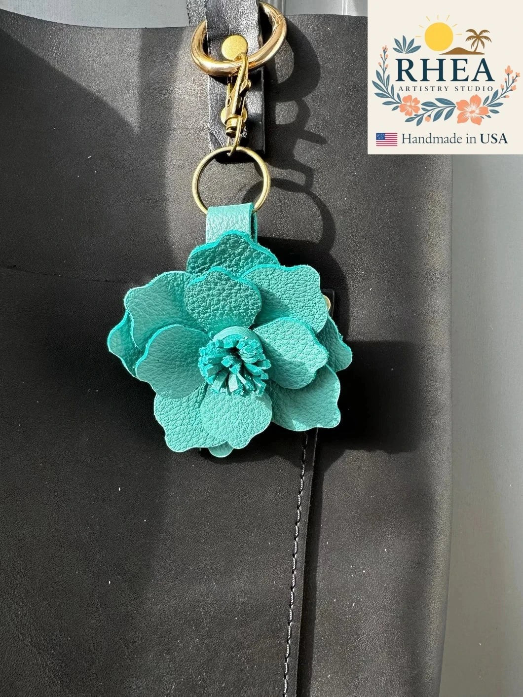Rhea Artistry Studio ocean/teal full grain leather flower charm with lobster clasp and split ring.