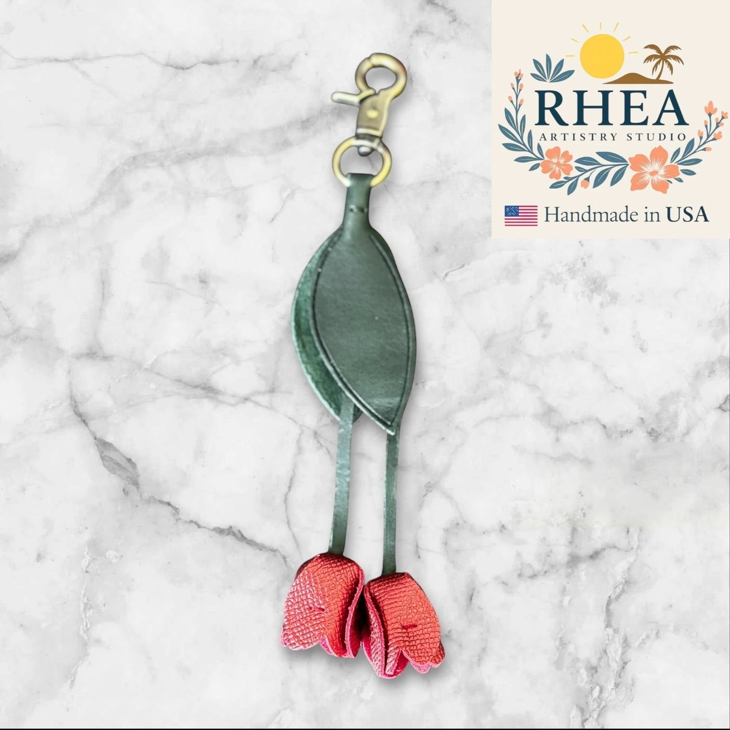 Rhea Artistry Studio handmade dark green leather tulip charm with red flower accents and gold lobster clasp, 7.5" long.