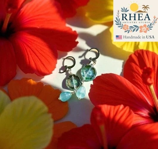Rhea Artistry Studio light blue and green hibiscus floral earrings with Czech glass and gemstones, surgical stainless steel.