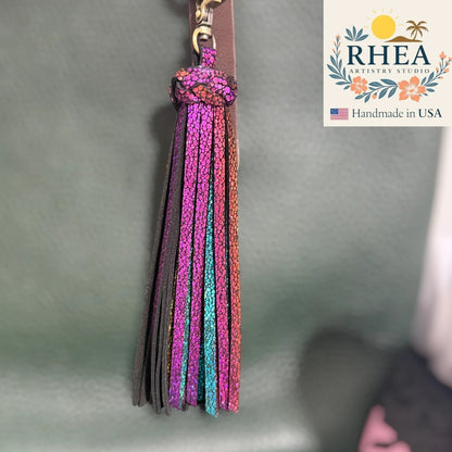 Rhea Artistry Studio handmade large leather tassel keychain with multicolor glitter finish and antique brass lobster clasp.