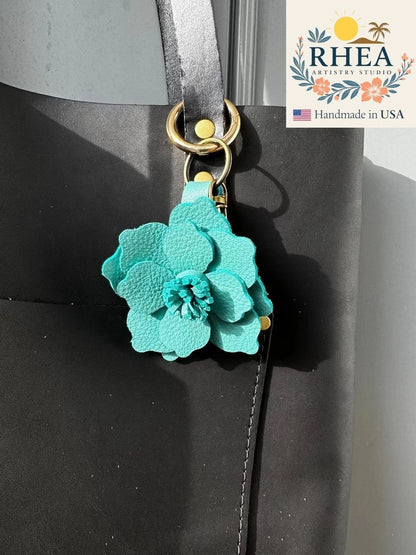 Rhea Artistry Studio ocean teal leather flower charm with lobster clasp and split ring.