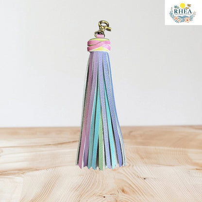Rhea Artistry Studio pastel rainbow leather tassel keychain with lobster clasp, handmade bag charm.